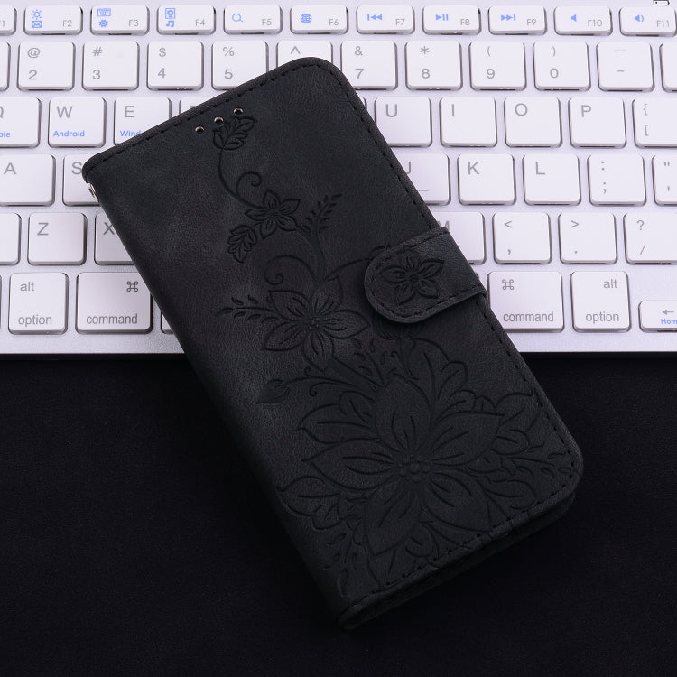 For iPhone 16e Lily Embossed Leather Phone Case(Black) by bashfashion