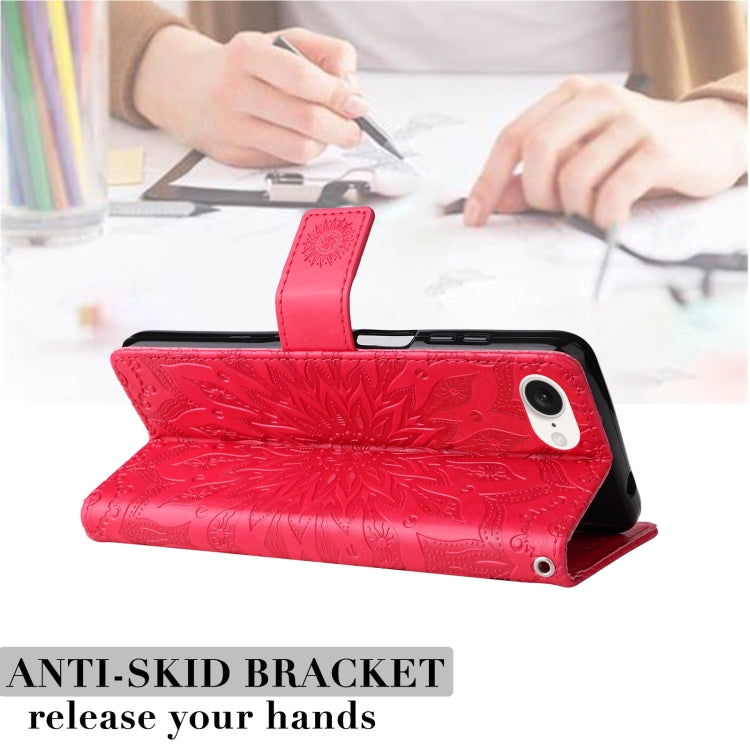 For iPhone 16e Embossed Sunflower Pattern Flip Leather Phone Case(Red) by bashfashion